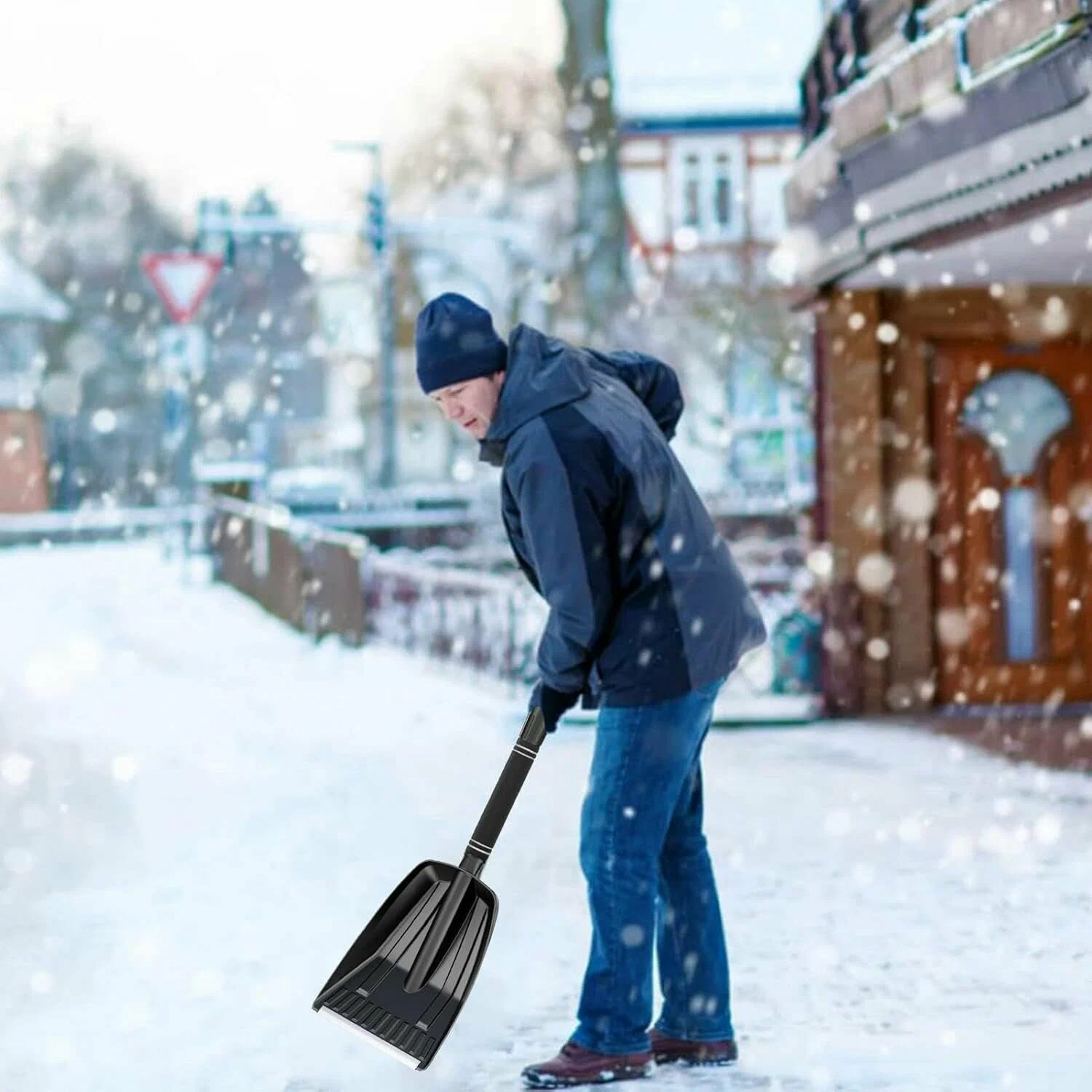 Snow plow clearing parking lot