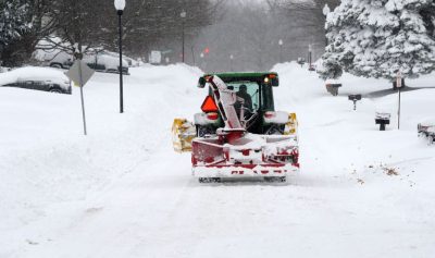 DERBY, NEW YORK - DECEMBER 01: A snow removal machine makes its way along Nettle Creek Road  after over two feet of heavy lake effect snow on December 1, 2024 in Derby, New York. The North Eastern storm that closed a ninety mile stretch of The New York State Thruway and snarled holiday traffic across the country dumped more than four feet of snow around Buffalo and its southern suburbs and is expected to continue throughout the weekend.  (Photo by John Normile/Getty Images)